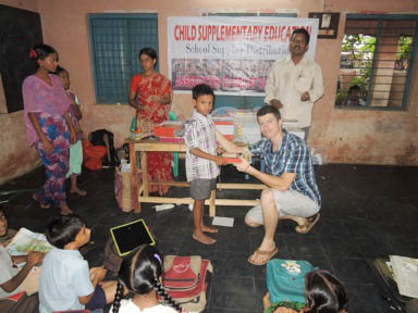 Jonathan helped give school supplies to Indian students in grades 1 - 10.